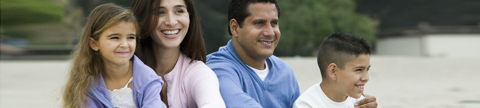 Hispanic family sitting together