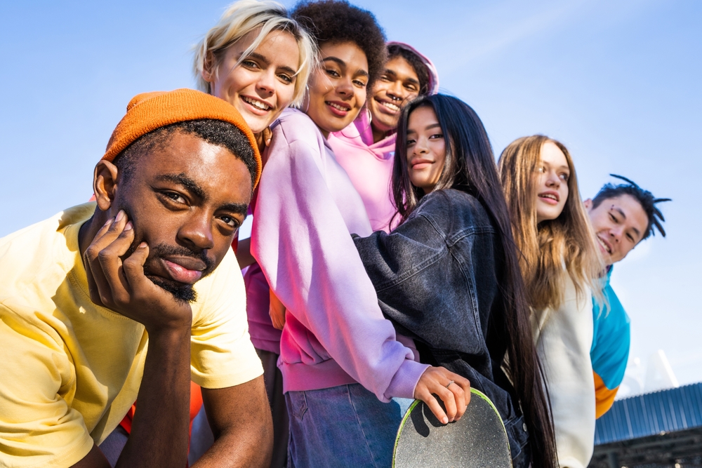 Multicultural,Group,Of,Young,Friends,Bonding,Outdoors,And,Having,Fun